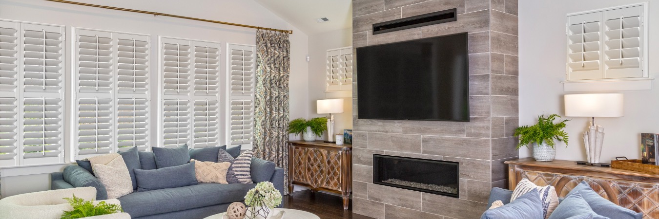 Plantation shutters in Lacey living room with fireplace